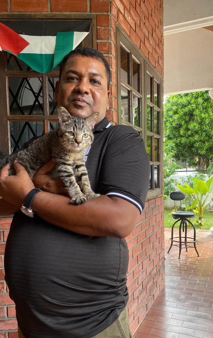 Satisfied customer with their freshly groomed cat at Catsville