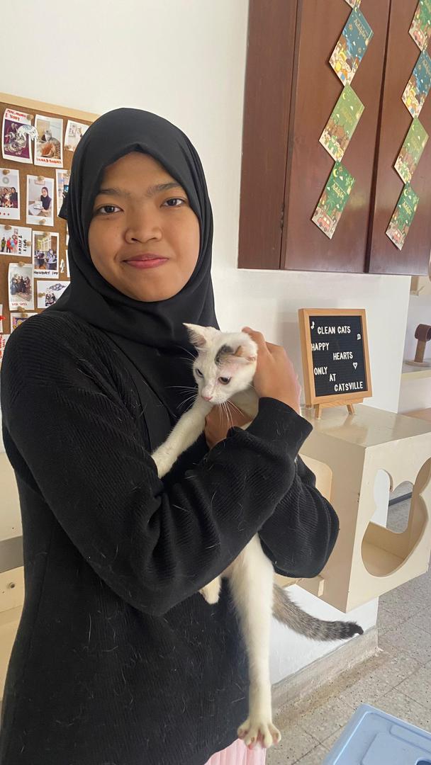 Cat owner reunited with cat after boarding stay