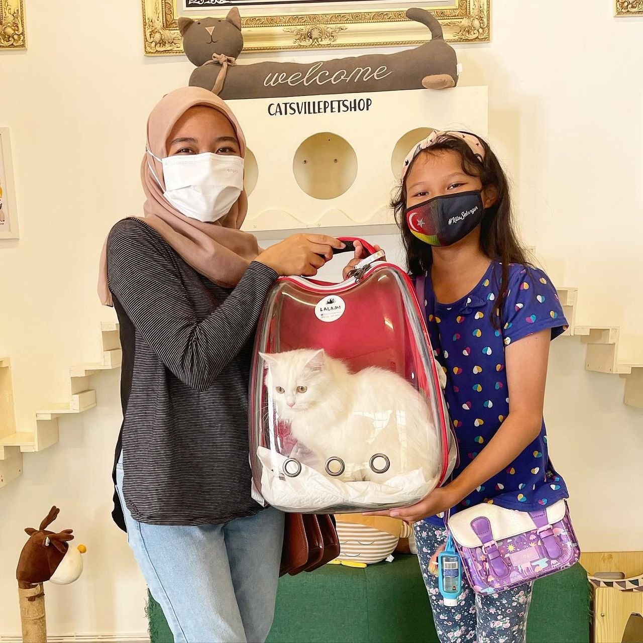 Friendly pick-up moment with cat parent in Subang Jaya